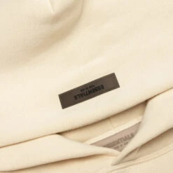 Essentials Essential Hoodie - Egg Shell -Fashion Clothing Store Fear of God Essentials Essential Hoodie Egg Shell 192SU222050F 01 10 23 Feature JP 7