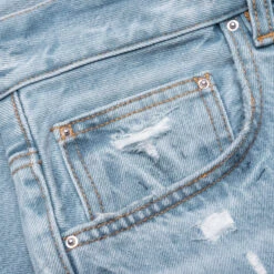 Amiri Straight Fit Aloha Patch Jean - Faded Indigo -Fashion Clothing Store Straight Fit Aloha Patch Jean Faded Indigo PF23MDF020 519 08 16 23 Feature KN 7 scaled